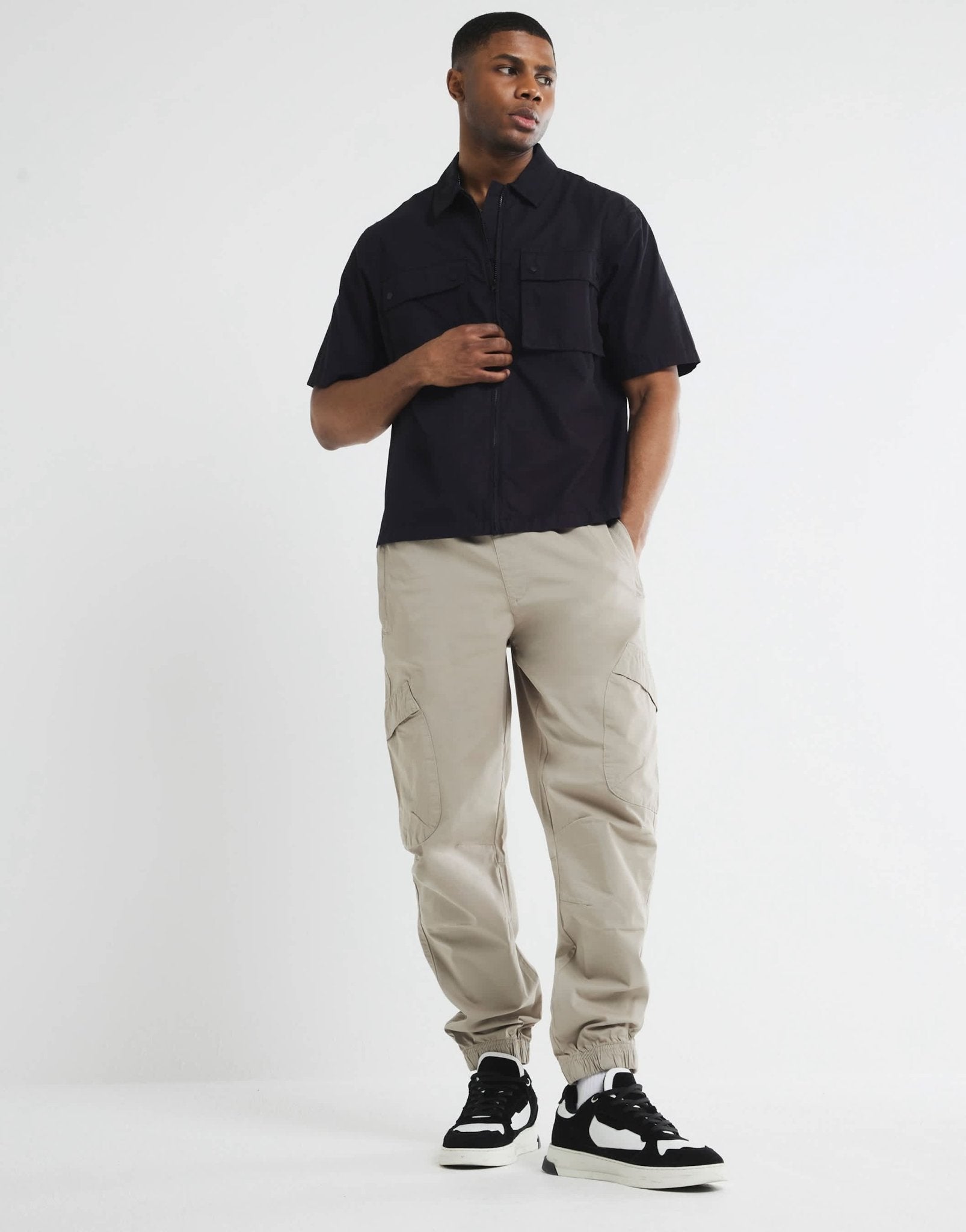 River Island cuffed cargo trousers in medium stone - ASOS Sample Sale