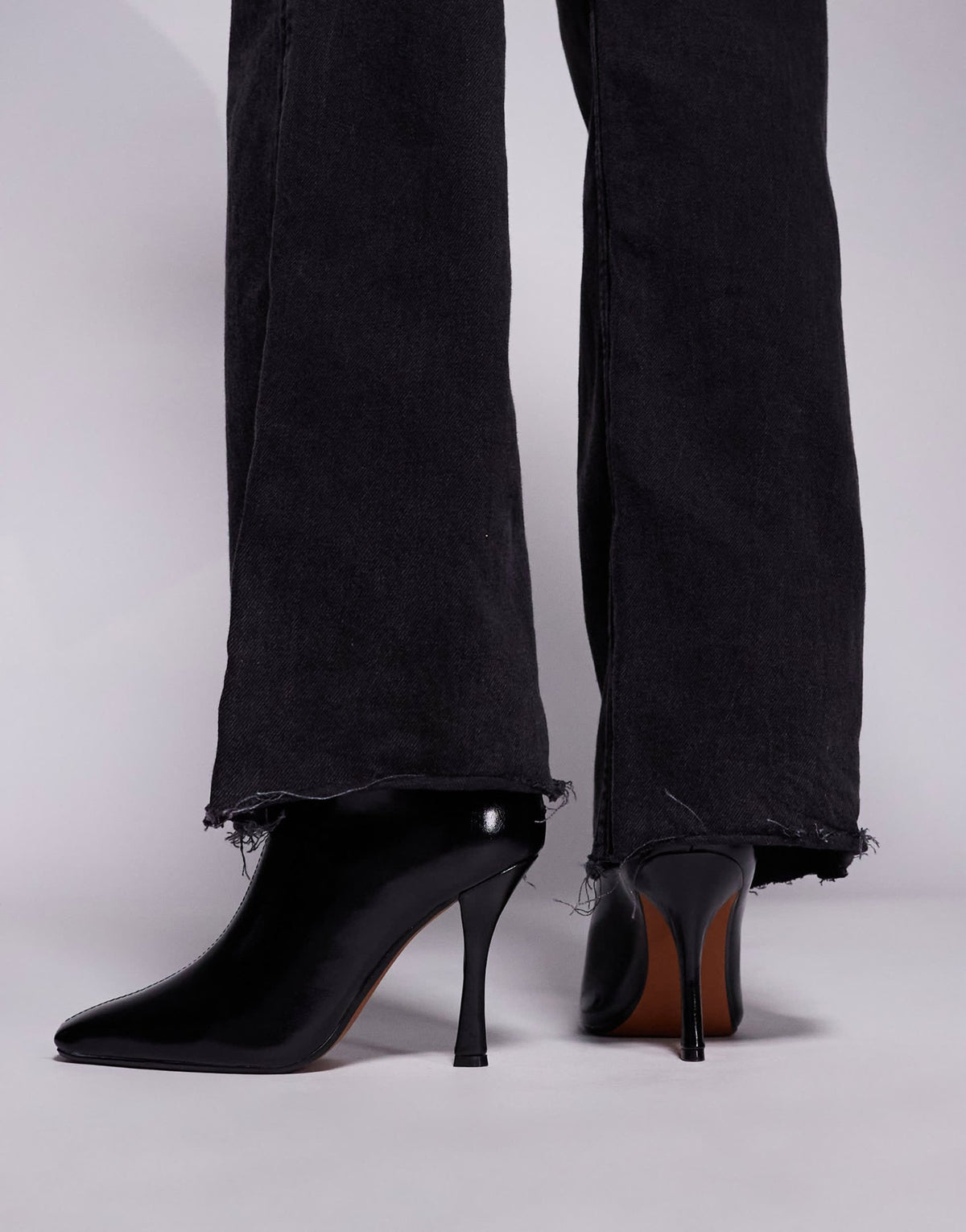 River Island slanted clean heeled boot in black - ASOS Sample Sale