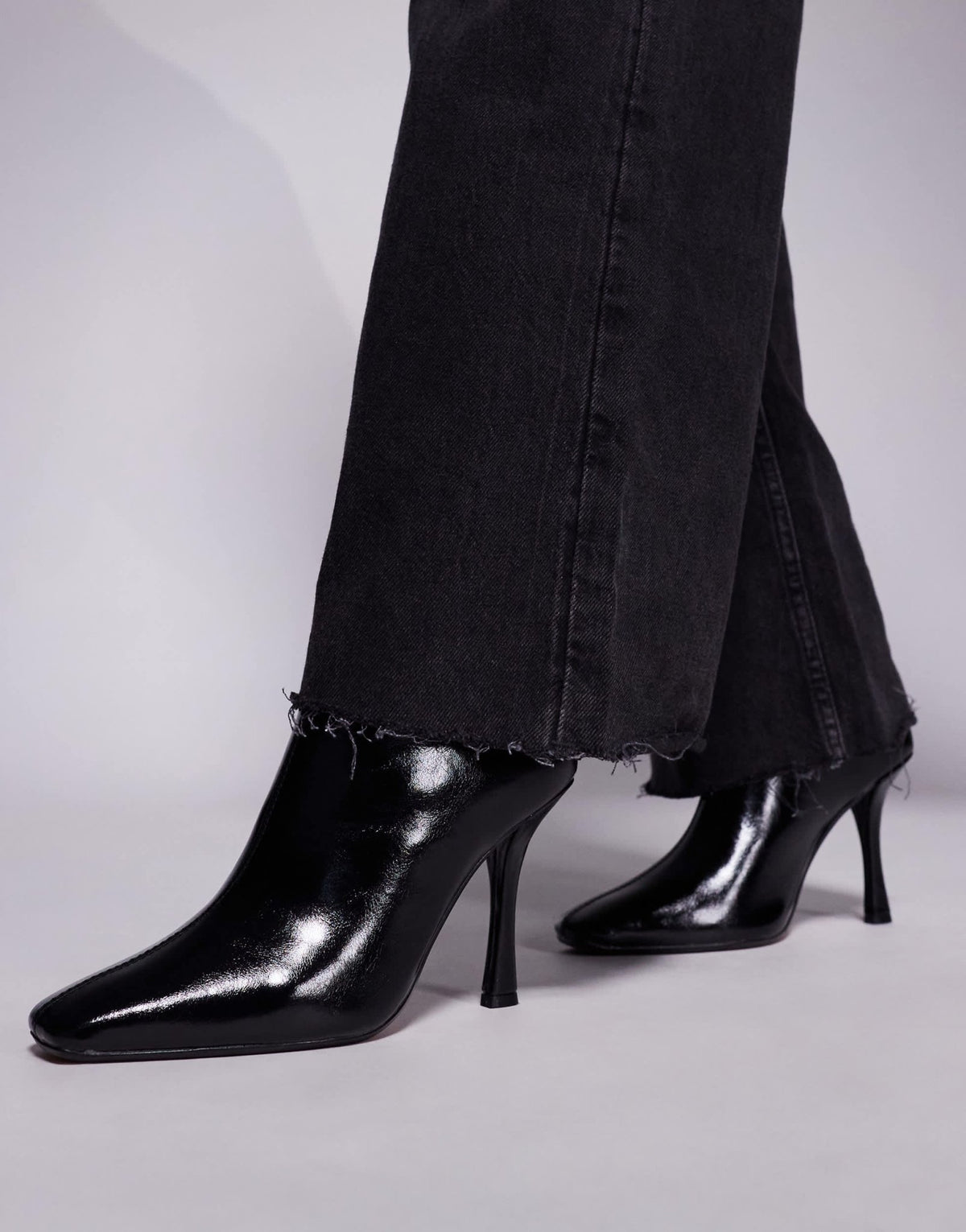 River Island slanted clean heeled boot in black - ASOS Sample Sale
