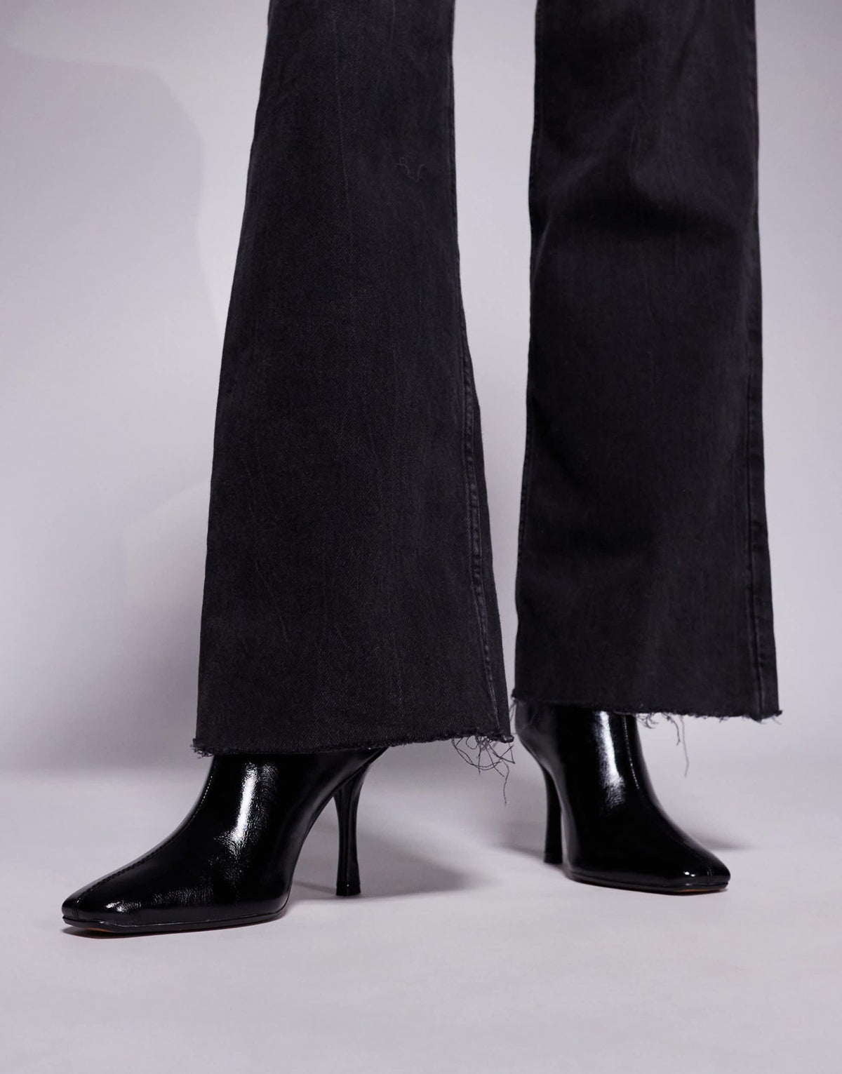 River Island slanted clean heeled boot in black - ASOS Sample Sale