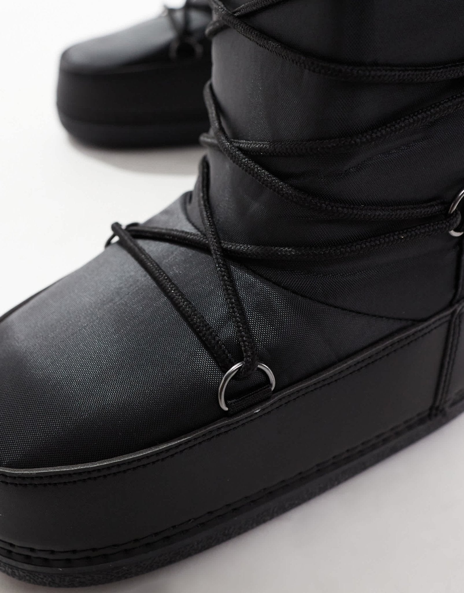 SEQWL knee high snow boots in black - ASOS Sample Sale
