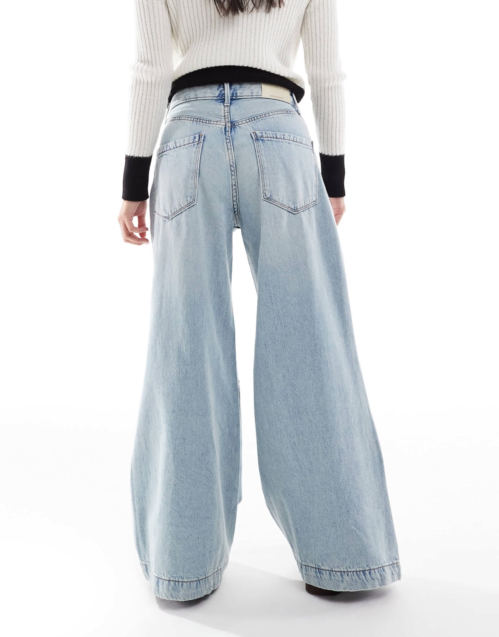Stradivarius Petite wide flare jean in light wash blue - ASOS Sample Sale