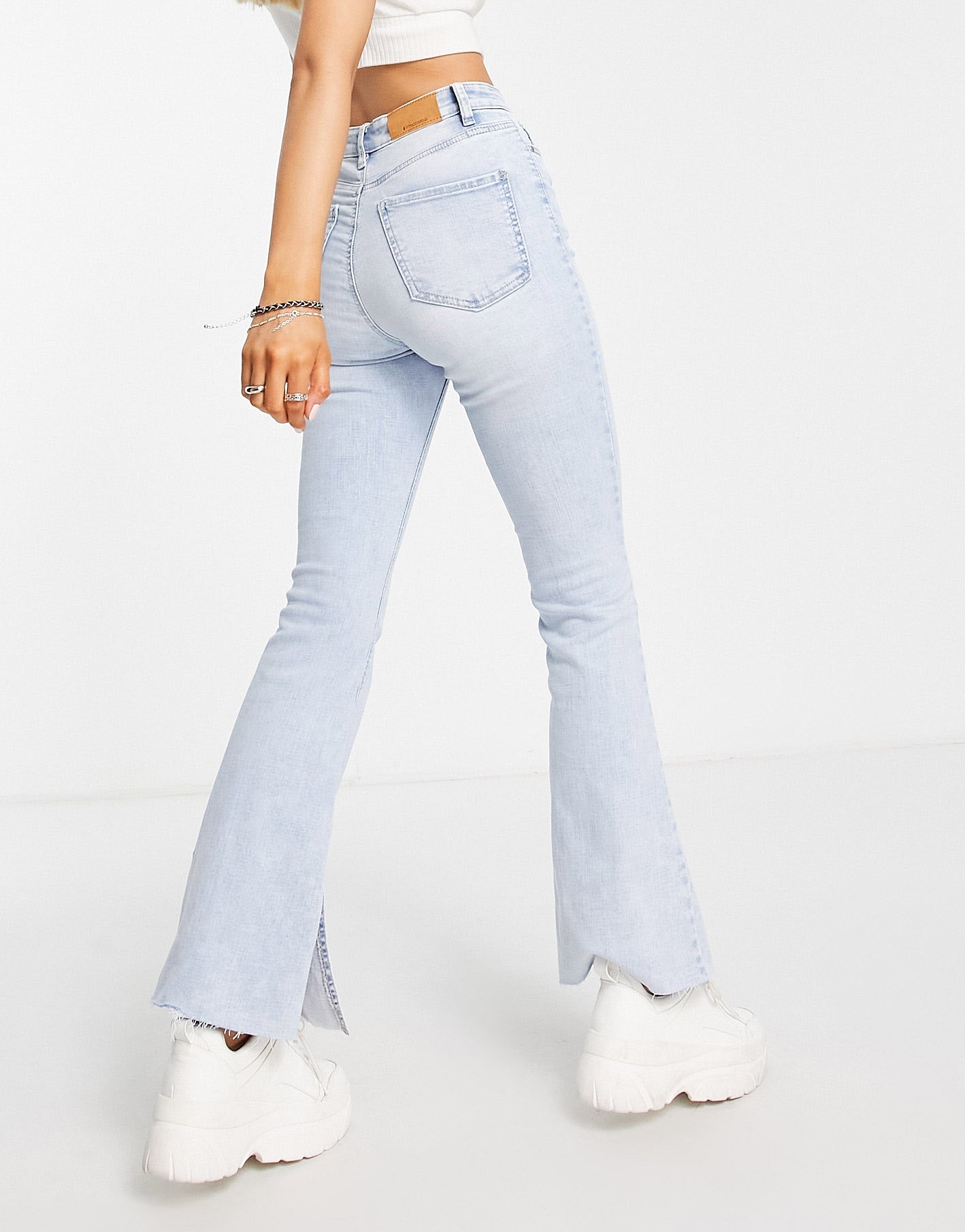 Stradivarius stretch flare jean with split detail in medium blue - ASOS Sample Sale
