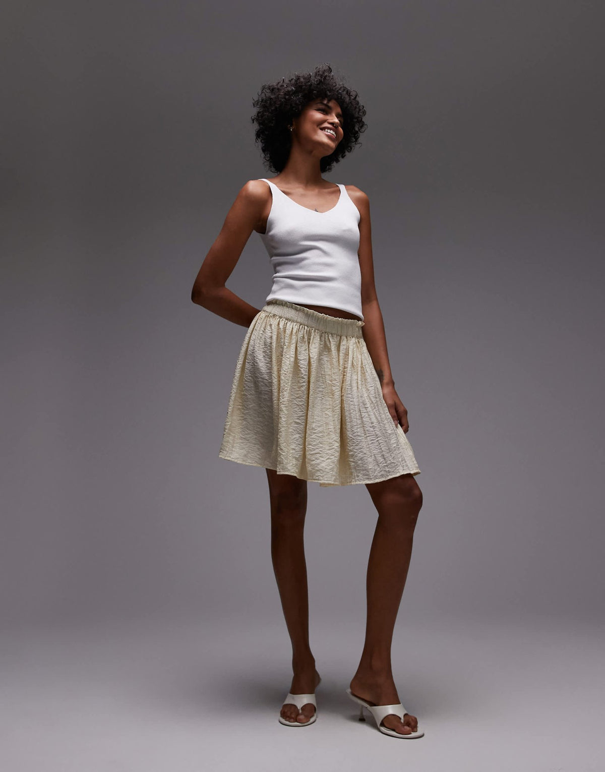 Topshop flippy crinkle mini skirt in sand - ASOS Sample Sale