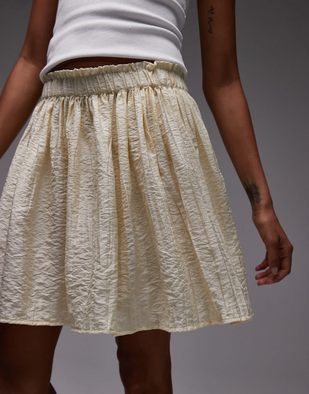 Topshop flippy crinkle mini skirt in sand - ASOS Sample Sale