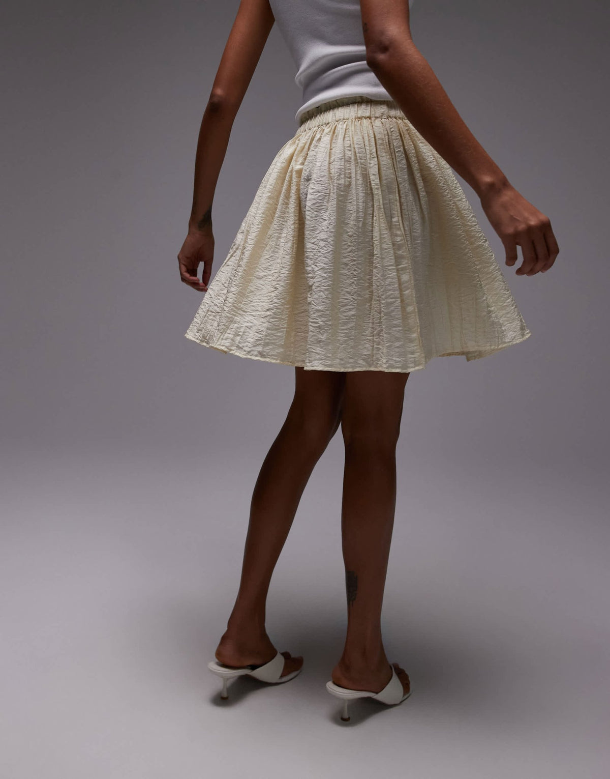 Topshop flippy crinkle mini skirt in sand - ASOS Sample Sale
