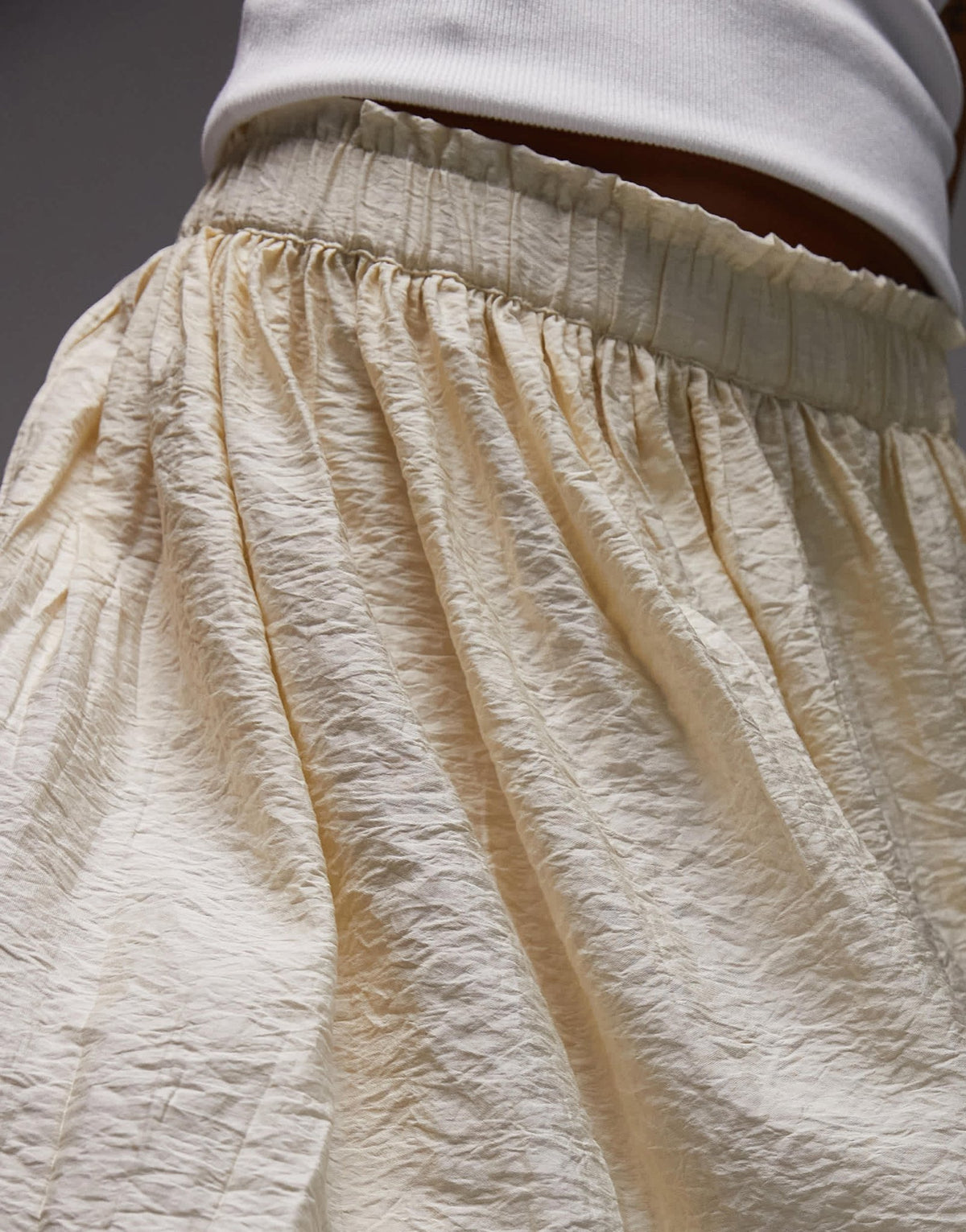 Topshop flippy crinkle mini skirt in sand - ASOS Sample Sale