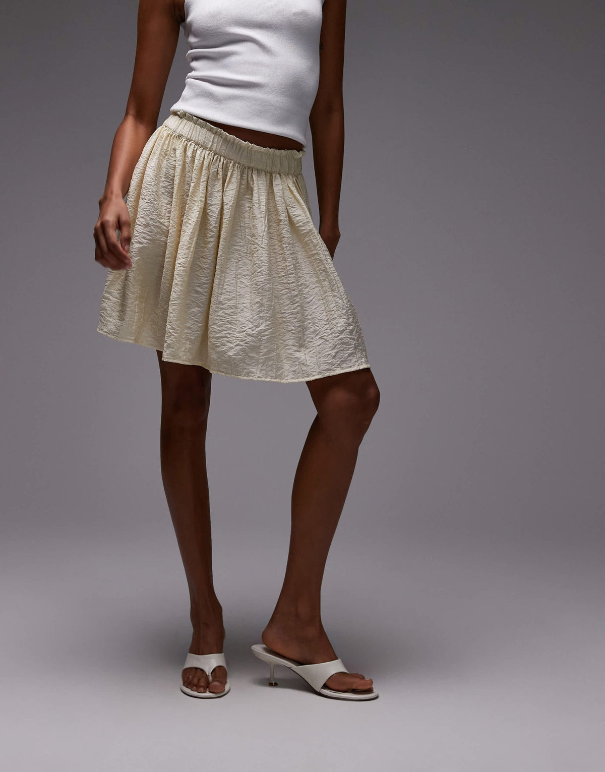 Topshop flippy crinkle mini skirt in sand - ASOS Sample Sale