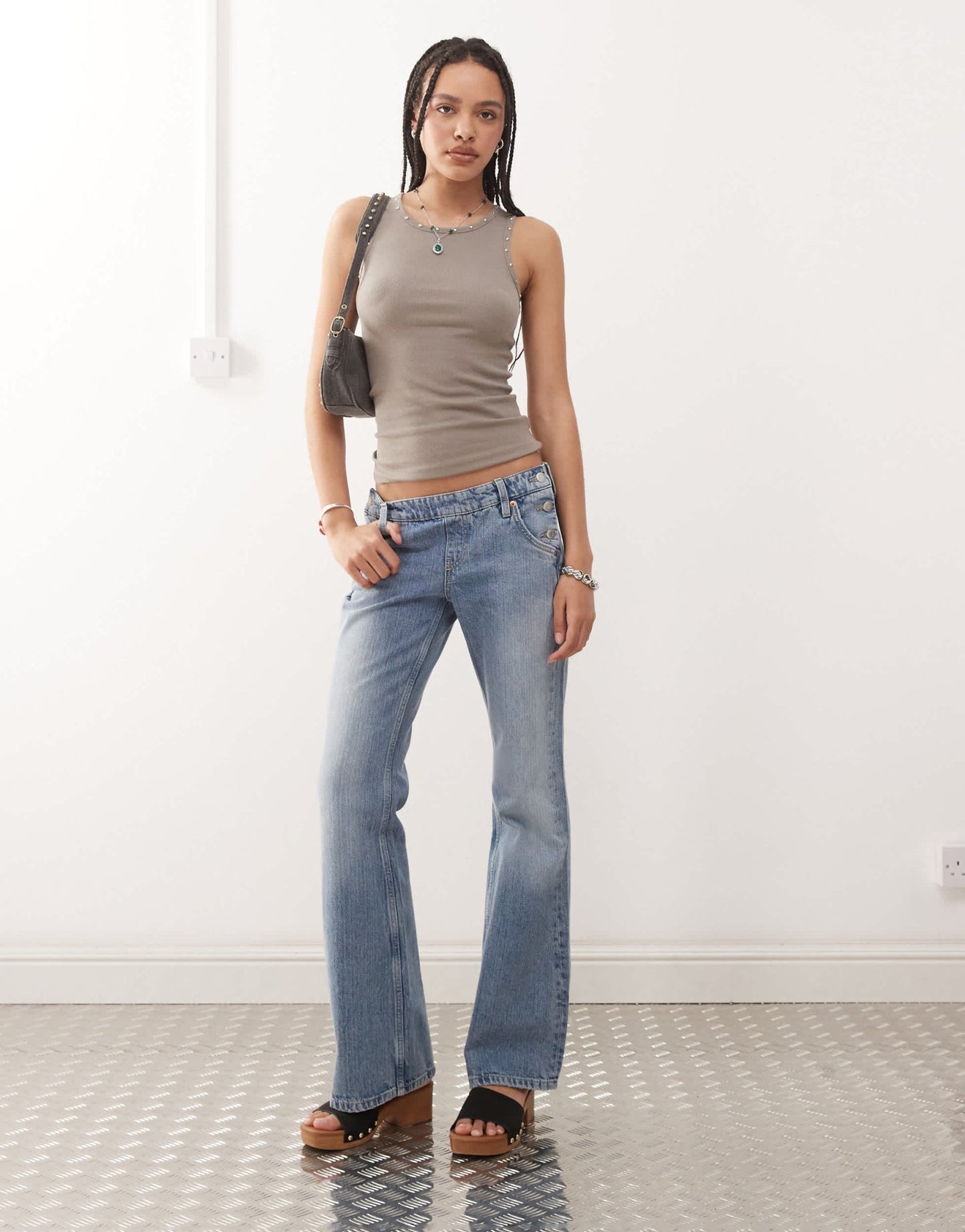 Weekday low waist flare jeans with side button western detail in streaky blue wash - ASOS Sample Sale