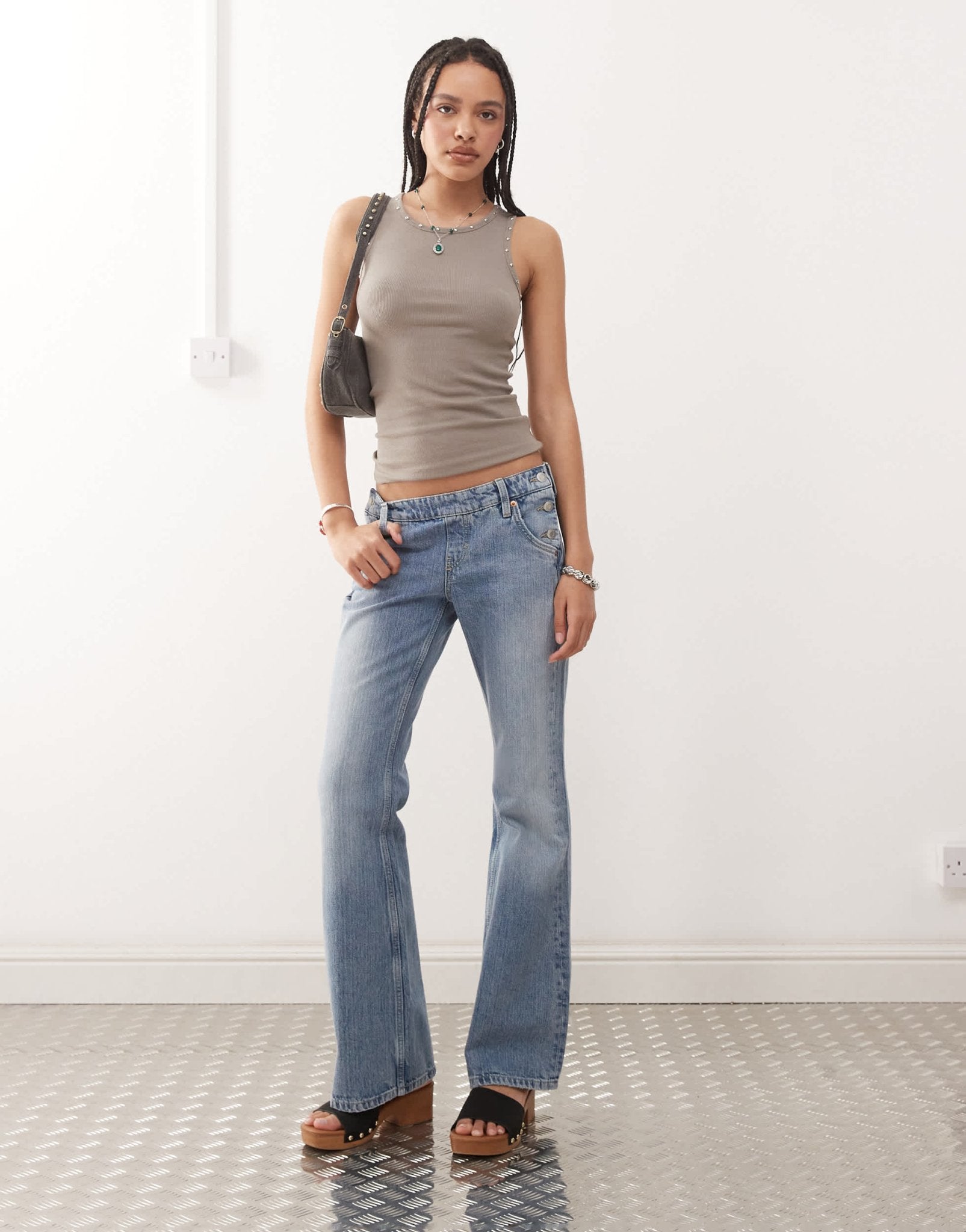Weekday low waist flare jeans with side button western detail in streaky blue wash - ASOS Sample Sale