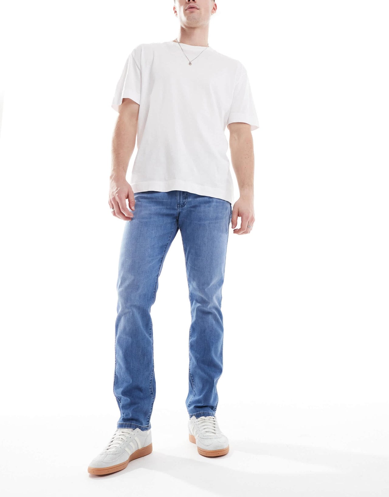 Wrangler Larston slim tapered fit jeans in mid wash blue - ASOS Sample Sale